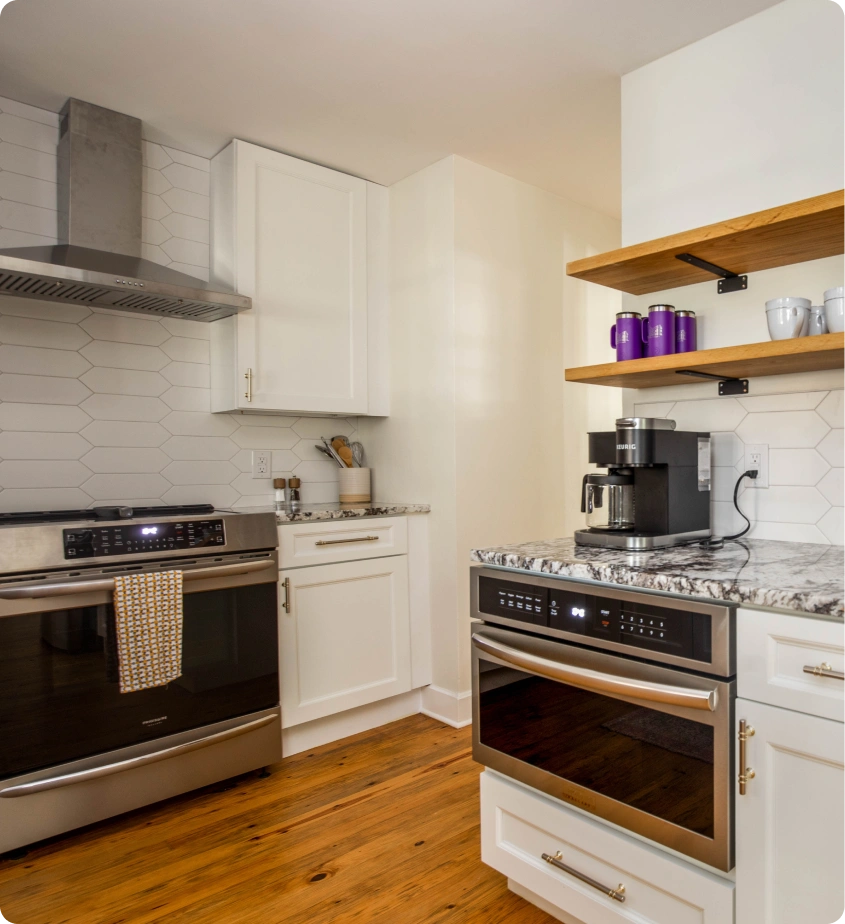 Modern kitchen with stainless appliances.